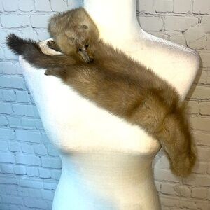 Double mink stole. They are sewn together. 2 heads, 2 tails and 4 feet.